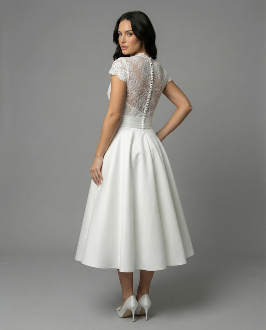 Elegant White Wedding Dress with Lace Bodice and Full Skirt