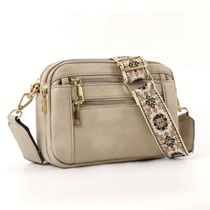 Leather Crossbody Bag with Embroidered Strap and Multi-Zip Pockets