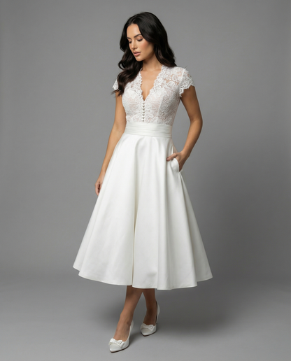 Elegant White Wedding Dress with Lace Bodice and Full Skirt