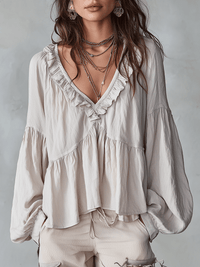 Relaxed Ruffle Blouse with V-Neckline and Puff Sleeves