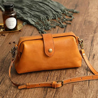 Retro Leather Crossbody Bag with Snap Closure and Brass Hardware
